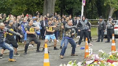 Members of a New Zealand biker club performed the Haka dance in front of the site of the mosque shootings in Christchurch, March 17./REUTERS/Joseph C.