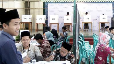 Santri use their vote on the 2019 Election Day at the polling booth in the vicinity of the Lirboyo Pesantren, in Kediri, East Java, on April  17.
