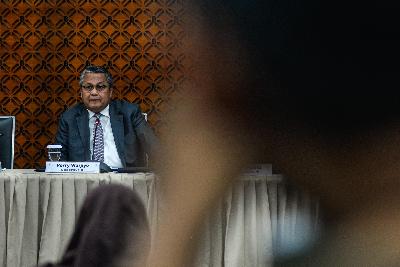 Gubernur Bank Indonesia (BI) Perry Warjiyo mengumumkan hasil Rapat Dewan Gubernur BI di Jakarta, November 2019. Tempo/Tony Hartawan