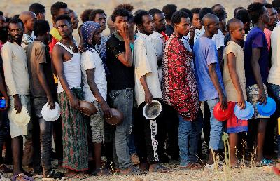 Warga Ethiopia yang melarikan diri dari perang di wilayah Tigray, di kamp Um-Rakoba, perbatasan Sudan-Ethiopia, di Sudan, 19 November 2020. REUTERS / Mohamed Nureldin Abdallah
