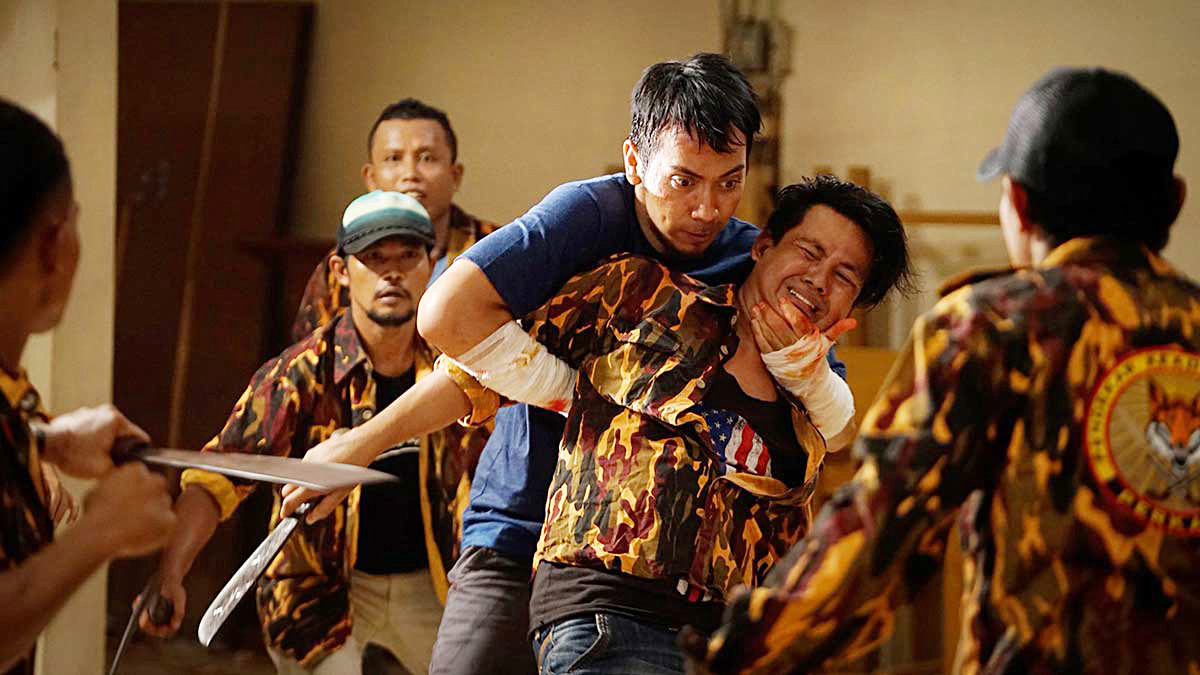 Khiva Iskak's action scene as a deaf thug in the film Preman.
