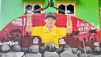 Mural perlawanan warga Desa Wadas menentang pembukaan tambang andesit, di Desa Wadas, Purworejo, Jawa Tengah, 11 Desember 2021. TEMPO/Francisca Christy Rosana