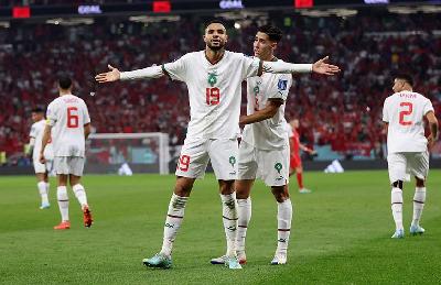 Pemain Maroko, Youssef En-Nesyri melakukan selebrasi usai mencetak gol ke gawang Kanada di Stadion Al Thumama, Doha, Qatar. 1 Desember 2022. REUTERS/Carl Recine