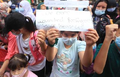 Pengungsi Afghanistan saat menggelar demonstrasi di depan kantor Badan Pengungsi PBB (UNHCR) di Jakarta, 2021. TEMPO/Subekti