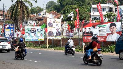 Campaign billboards of legislative candidates ahead of the Simultaneous Local Elections in Bandung, West Java, December 2023. Shutterstock